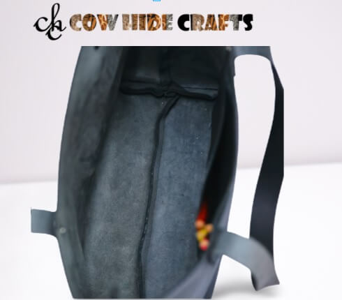 Raw suede interior lining on black leather luxury tote handbag
