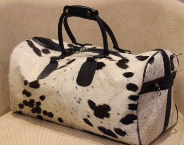 black and white cowhide rectangle duffle bag