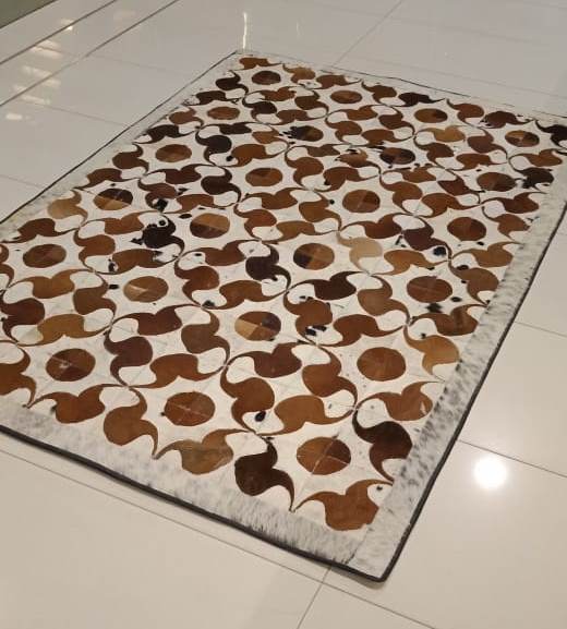 Rectangle cowhide rug curved circle pattern detail
