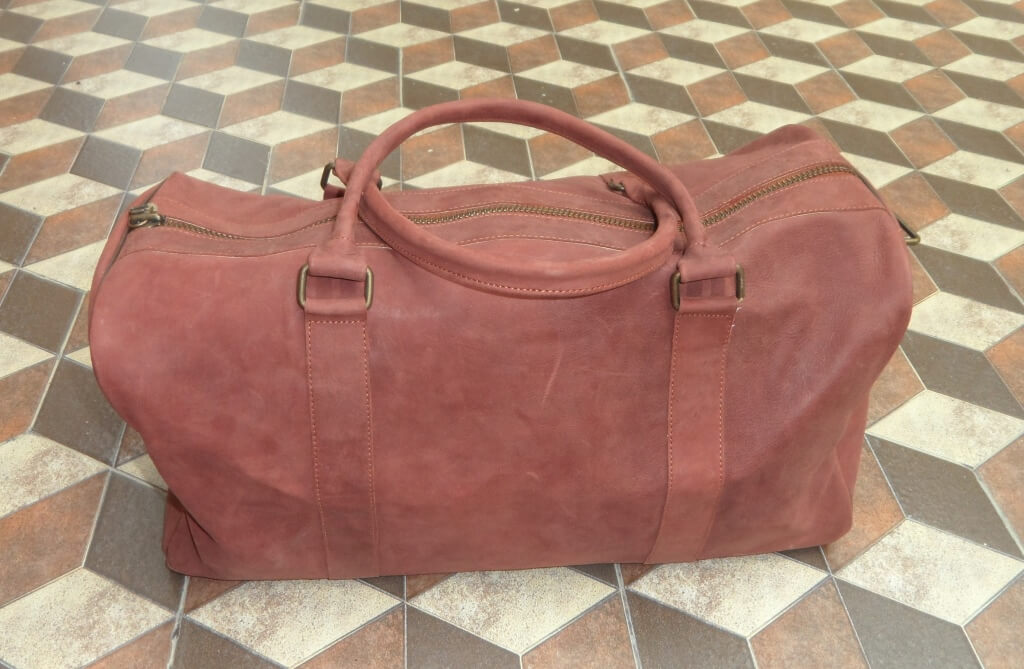 red leather duffle bag 