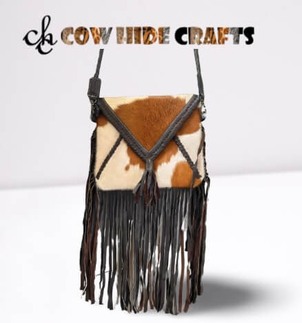 Rodeo style fringe cowhide bag tan white