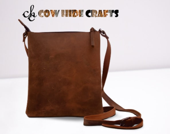Rough texture detail on vintage brown leather shoulder bag