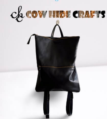 Sleek leather backpack black gold zippers