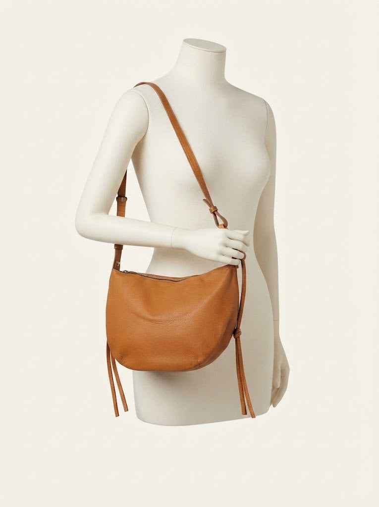 Slouchy leather dumpling crescent bag in tan