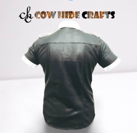 Stud button closure detail on black white military leather shirt