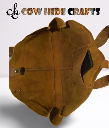 Suede lining and snap closure on raw vintage leather bucket bag