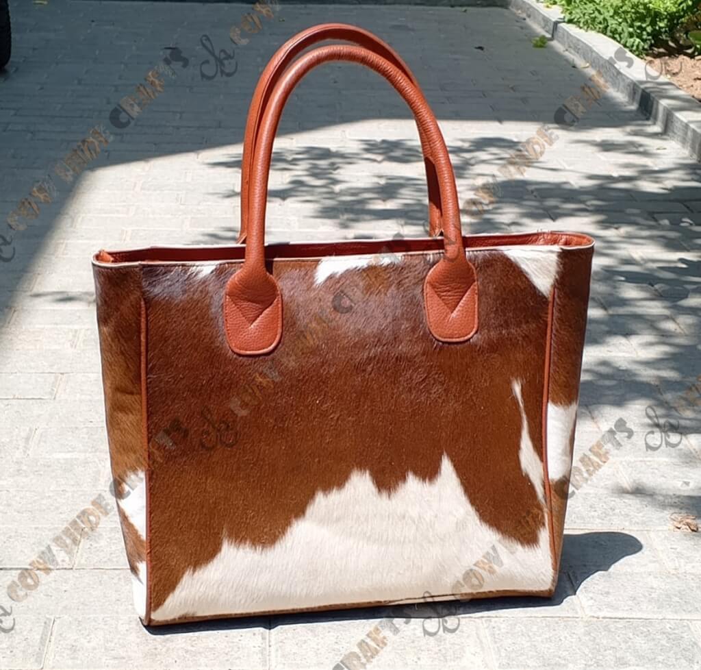 Tan cowhide bag full hair on construction