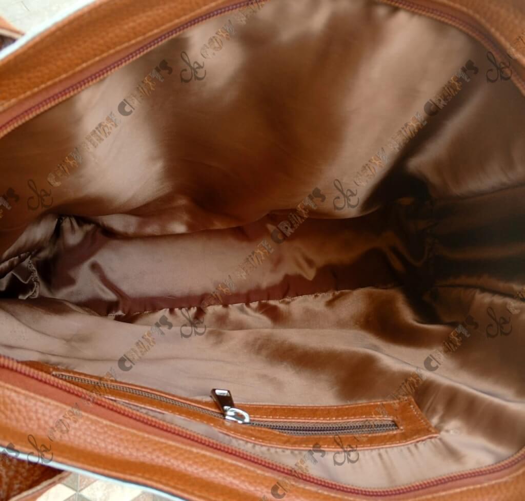 Tan cowhide large shoulder bag lined interior
