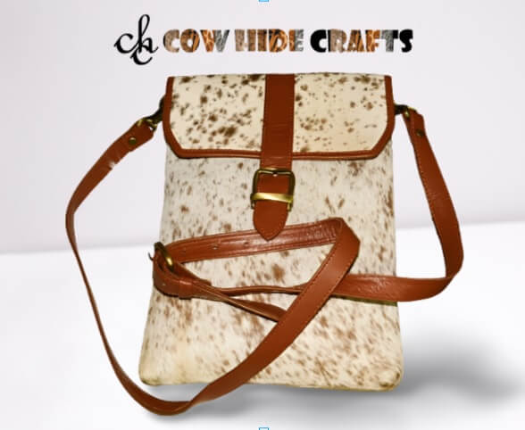 Tan cowhide sling purse long adjustable strap