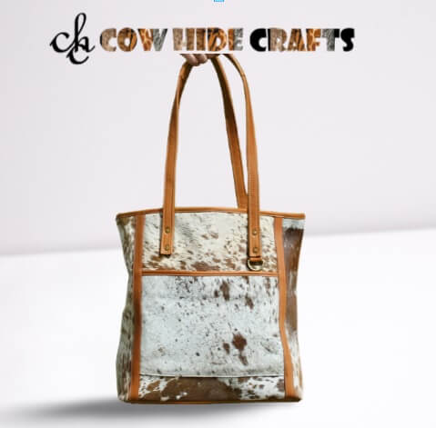 Tan cowhide tote outside open pocket key ring