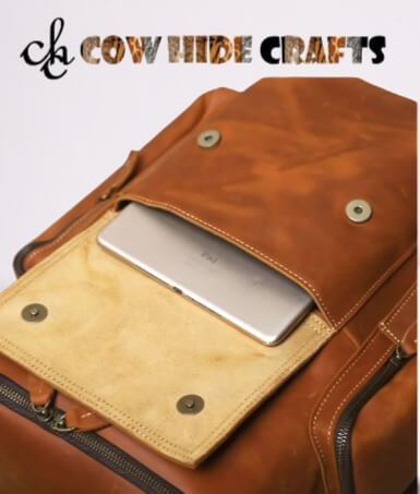 tan leather rucksack with laptop sleeve