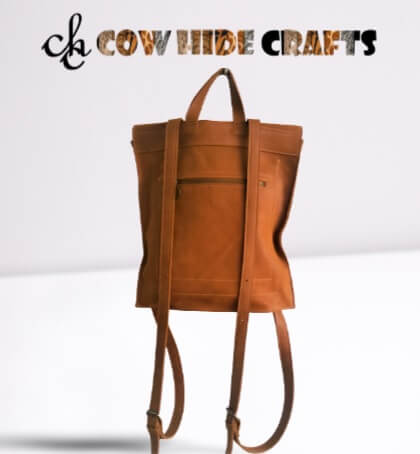 Tan rolltop backpack top handle and straps