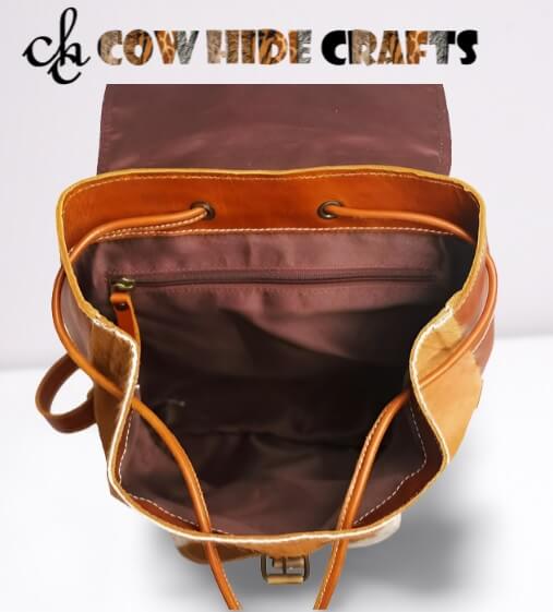 Tan white cowhide bag flap drawstring closure