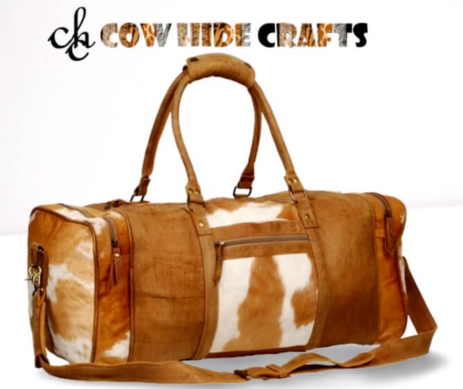 Tan white cowhide duffle bag