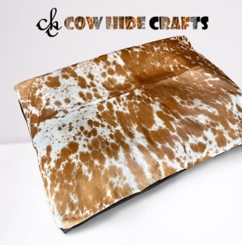 Tan white cowhide pet bed cover front view