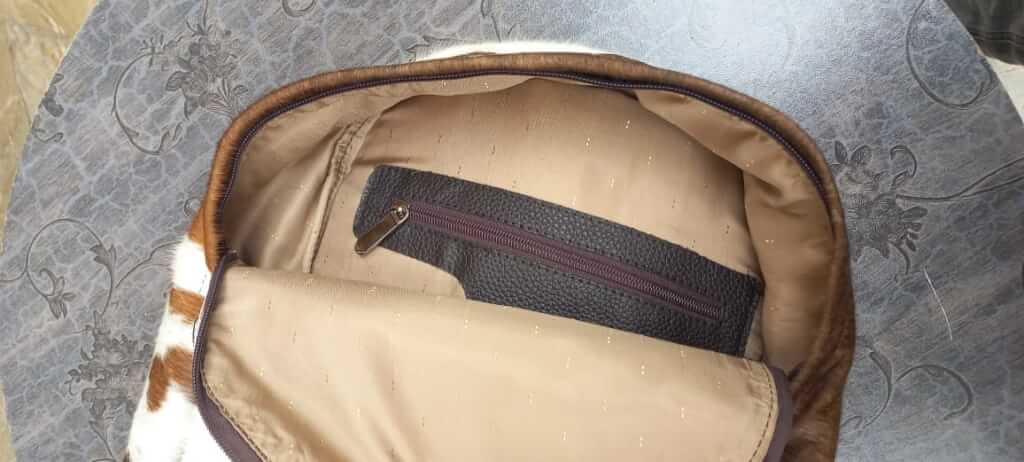 Tan white cowhide sphere bag inside view