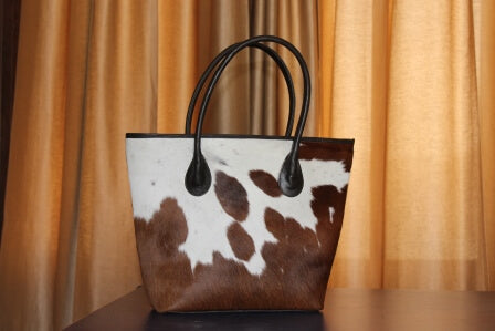 Tan white cowhide tote brown leather