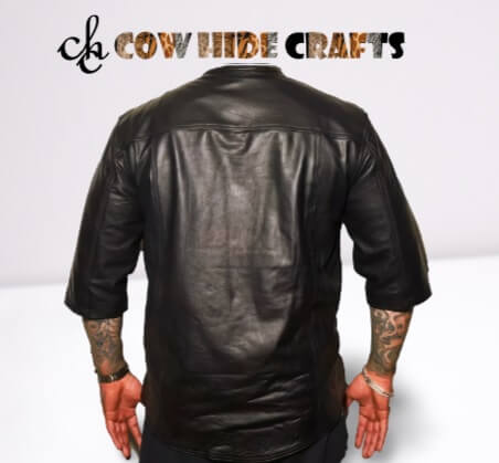 Three-quarter sleeves detail on collarless black leather shirt