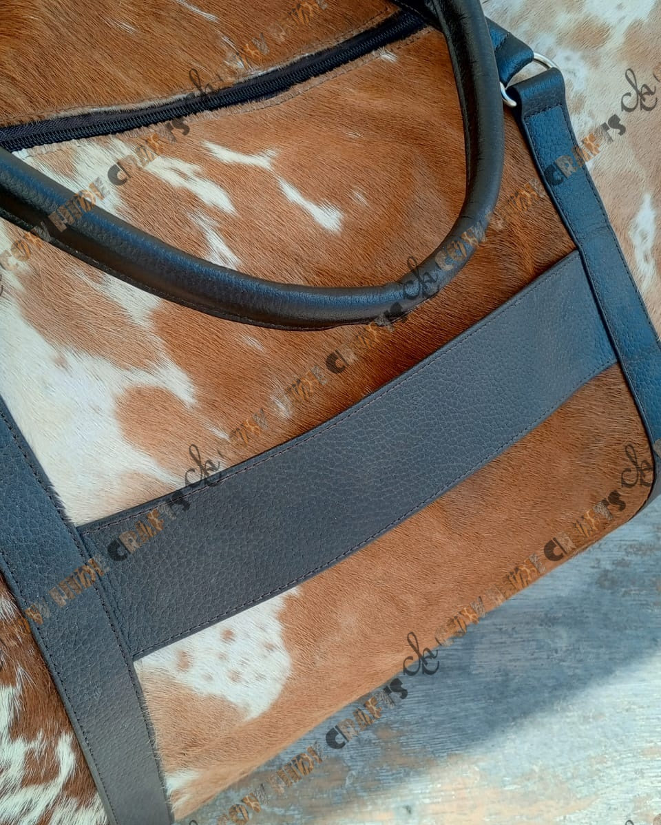 Cowhide travel bag with trolley sleeve