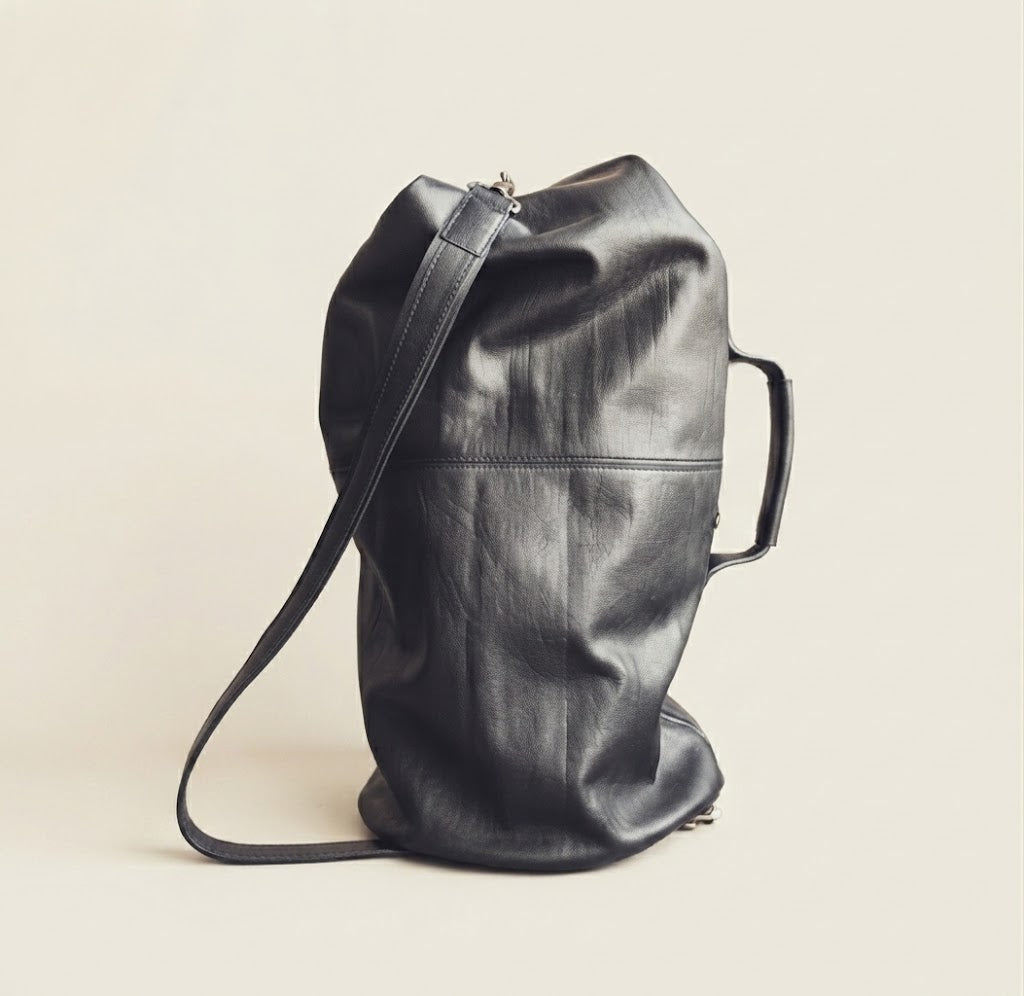 Two way carry convertible leather duffle backpack
