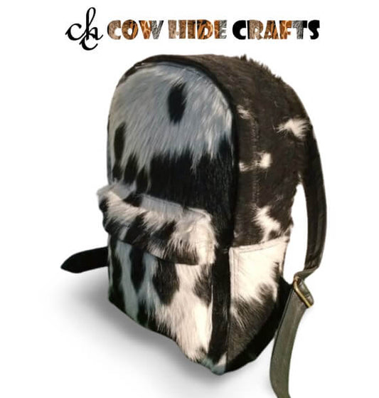 Black and white western cowhide backpack made with hair on hide leather