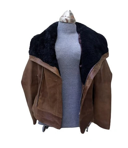 Wide faux fur shearling collar detail on brown leather jacket