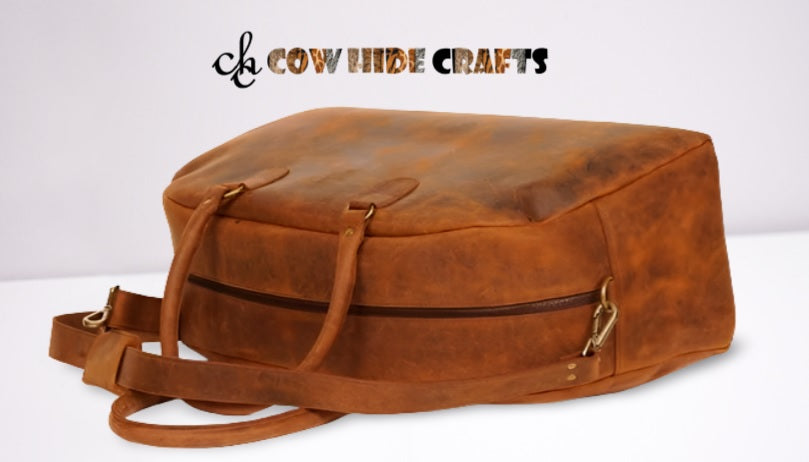 Wide main zipper closure on brown leather weekend duffle bag