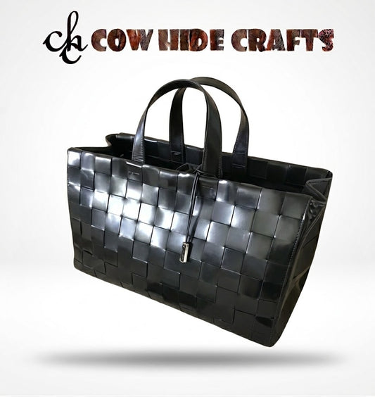 Woven black leather tote bag front view with basket-weave pattern