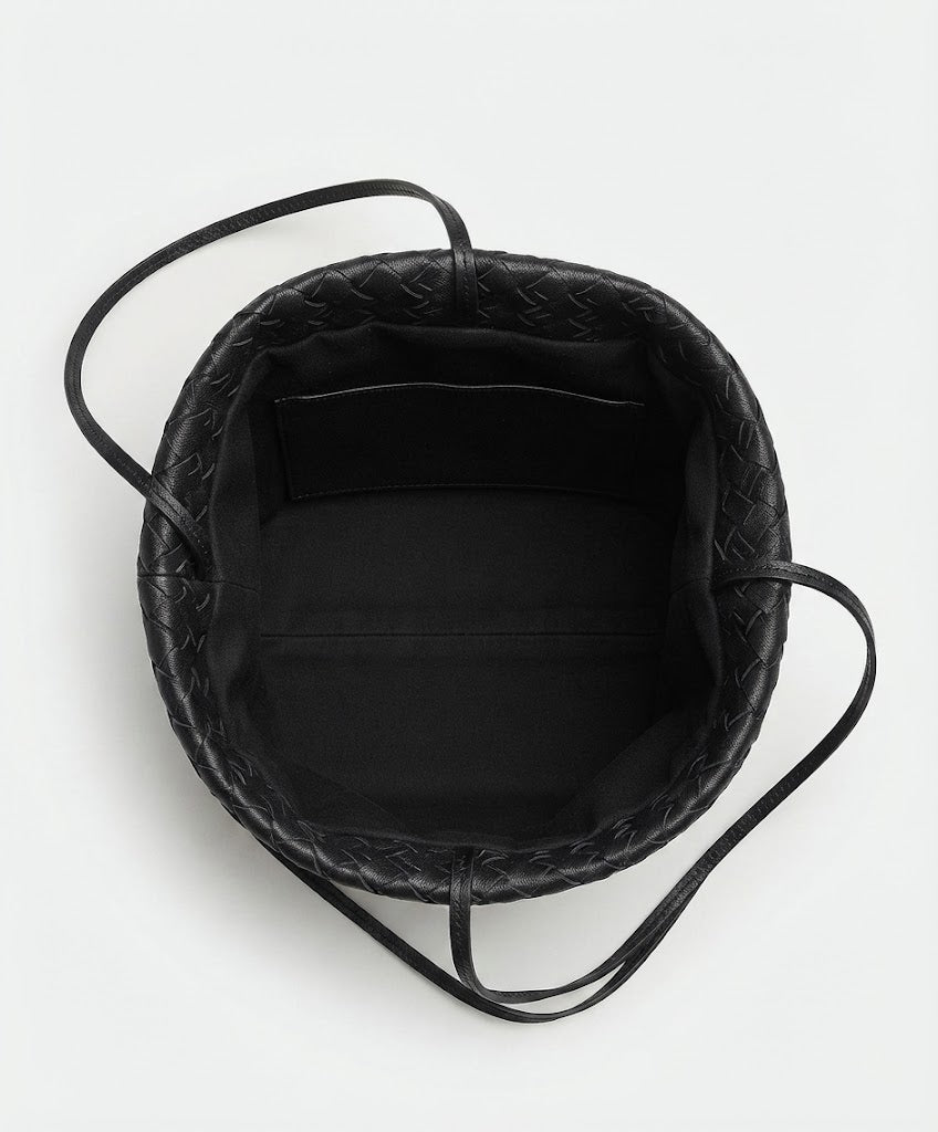 Fully lined interior with zip pocket inside woven leather tote
