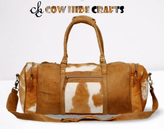 Brown and white cowhide large duffle bag.