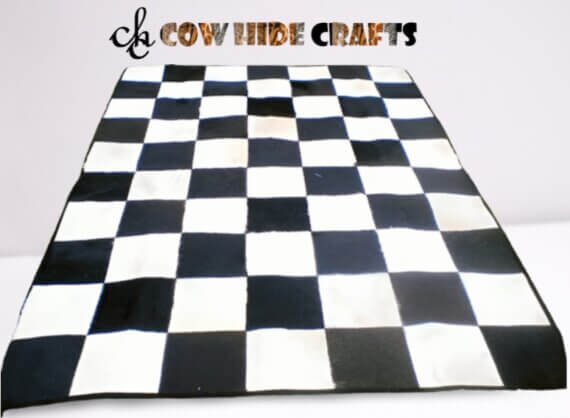 Checker board black and white cowhide rugs.